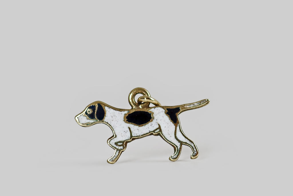 Antique Jewelry Portland, Vintage Jewelry Portland , Antique Engagement Rings | Poor Mouchette | A rare and wonderful Art Deco era charm, modeled in 14k yellow gold, depicting a handsome pointer dog, in a pointing posture. This flat-lay charm is illustrative in style—  the dog's form is outlined with polished gold borders, while his body is "filled in" with subtly-speckled white enamel. 