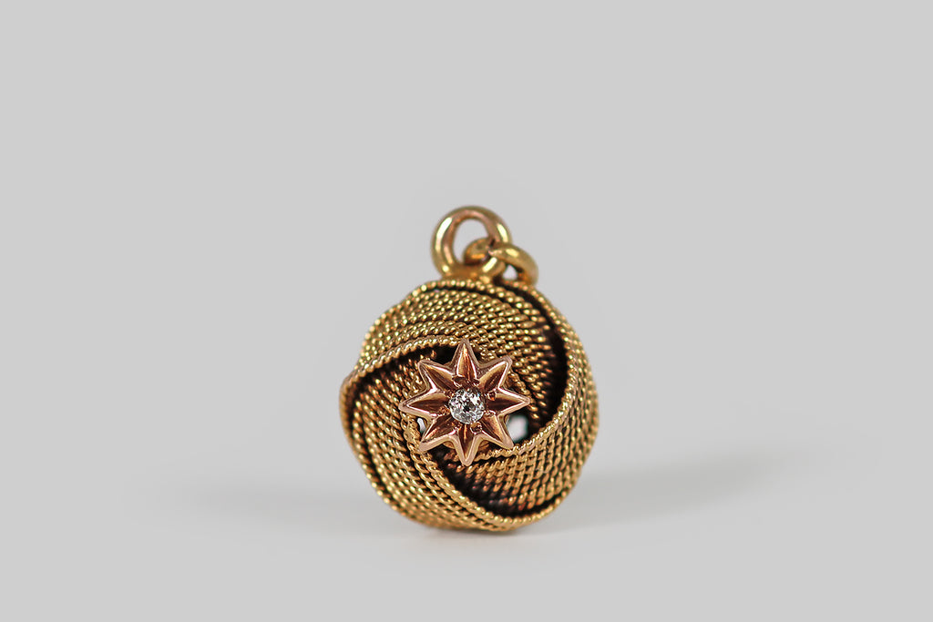 Poor Mouchette | Curated Antique Jewelry, Vintage Jewelry & Engagement Rings | Portland, Oregon | A sweet Victorian era pendant or charm, modeled in 14k gold as a sailor's knot with an eight pointed star at its center. This endless knot is fashioned from many lengths of twisted gold wire that have been arranged to lay together in flat swaths, to emulate the construction of an actual sailors knot or monkey's-fist knot.