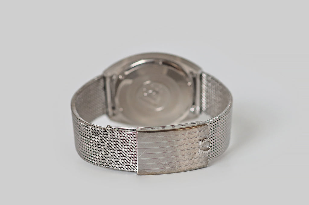 Vintage Watches Portland | Vintage Rolex Portland | Antique Jewelry Portland| Antique Engagement Rings | Poor Mouchette | An elegant, all original Omega Constellation wristwatch, in 18k white gold. This watch is rarely offered in white gold, and we love the way this metal compliments the watch's shining, softly-opalescent, silver dial. Bold, minimalist lines, an icy colorway, and the very subtle rays that emanate from the dial's center give this mid 20th century watch a clean, starry vibe.
