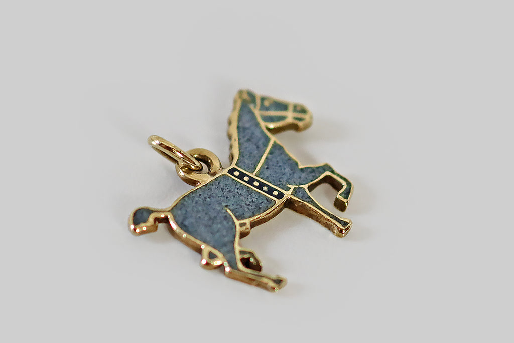 Antique Jewelry Portland, Vintage Jewelry Portland , Antique Engagement Rings | Poor Mouchette | A rare and wonderful Art Deco era charm, modeled in 14k yellow gold, depicting a handsome, bridled draft horse. This flat-lay charm is illustrative in style—  the horse's form is outlined with polished gold borders, while the body is "filled in" with beautiful, speckled, denim-blue enamel.