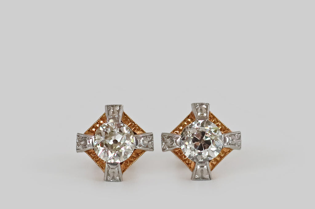 Poor Mouchette | Curated Antique Jewelry, Vintage Jewelry & Engagement Rings | Portland, Oregon | A pair of Art Deco era diamond stud earrings, modeled in 14k gold and platinum, each featuring a chunky, old European cut diamond. These antique diamonds are each held in four, stylized, platinum, tab-style prongs that stand off the earrings' yellow gold base, creating the impression of an "X" or a Maltese cross.
