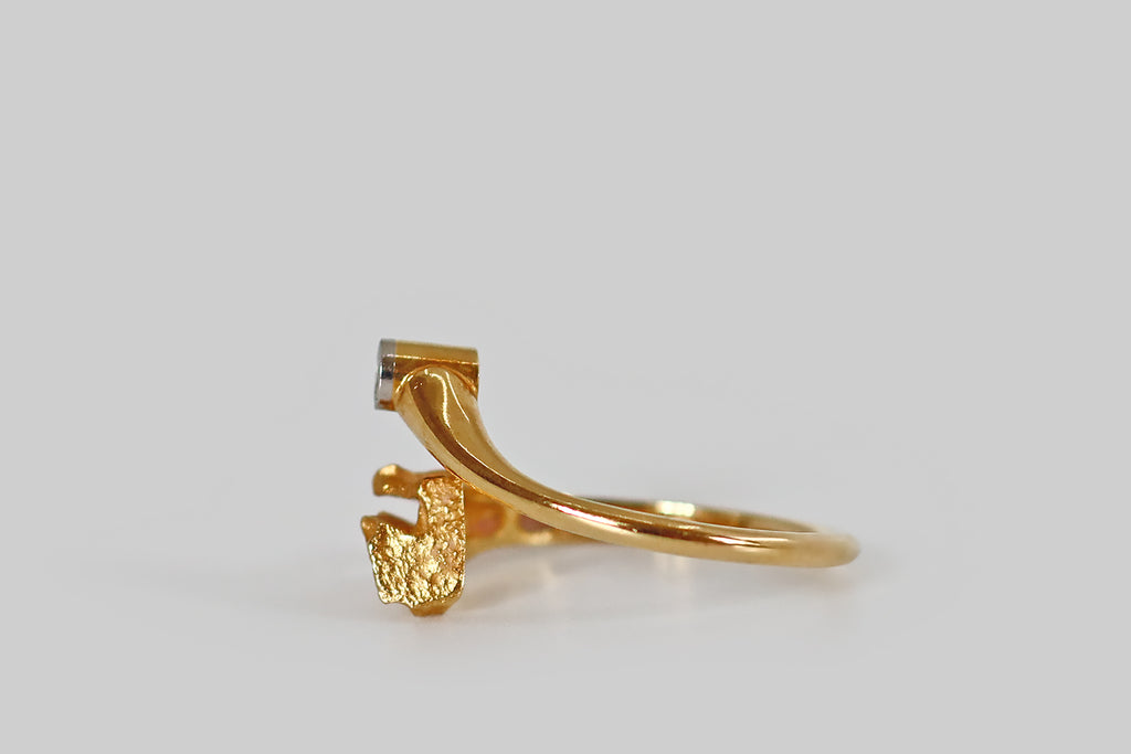Poor Mouchette | Curated Antique Jewelry, Vintage Jewelry & Engagement Rings | A mid-20th-century, modernist ring, modeled in 18k yellow gold for Lapponia, by the beloved Finnish designer Björn Weckström. This dainty bypass ring was made to resemble a comet, or shooting star. The tail of this comet is broader than the head— naturalistic and sculptural, it features organic textures, a high-color matte finish, and craggy, openwork areas. 