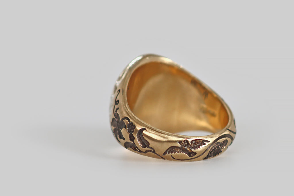 Antique Jewelry Portland, Vintage Jewelry Portland , Antique Engagement Rings | Poor Mouchette | A contemporary signet ring, modeled in 9k yellow gold and hand-engraved by the artist Castro Smith. This ring features a moon and owl motif— a crescent-shaped man-in-the-moon graces the ring face, his cheeks puffed out as if to blow a bubble, but instead he "blows" a moonflower! Flanking the moon, a pair of owls, with outstretched wings, decorate the ring's shoulders
