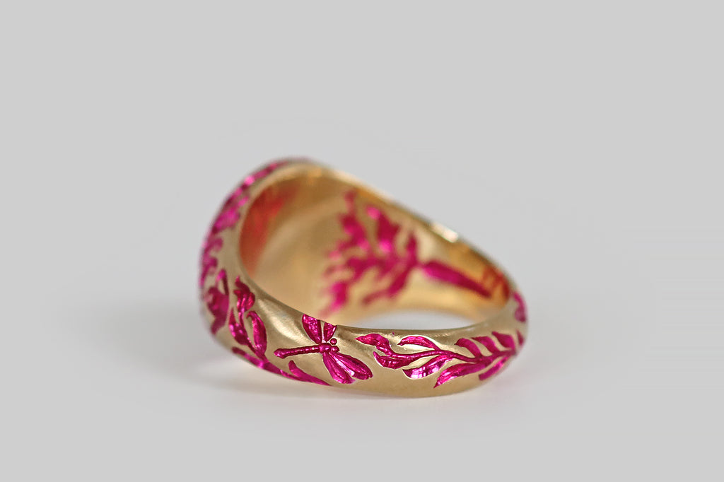 Poor Mouchette | Curated Antique Jewelry, Vintage Jewelry & Engagement Rings | Portland, Oregon | A contemporary signet ring, modeled in 9k yellow gold and hand-engraved by the artist Castro Smith. This ring features a garden motif— a peony with curvaceous foliage decorates the ring face, while a carrot, a watering can, leaves and dragonflies populate the ring's shoulders and shank. An additional, secret carrot lives inside 