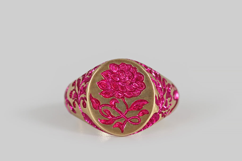 Poor Mouchette | Curated Antique Jewelry, Vintage Jewelry & Engagement Rings | Portland, Oregon | A contemporary signet ring, modeled in 9k yellow gold and hand-engraved by the artist Castro Smith. This ring features a garden motif— a peony with curvaceous foliage decorates the ring face, while a carrot, a watering can, leaves and dragonflies populate the ring's shoulders and shank. An additional, secret carrot lives inside 