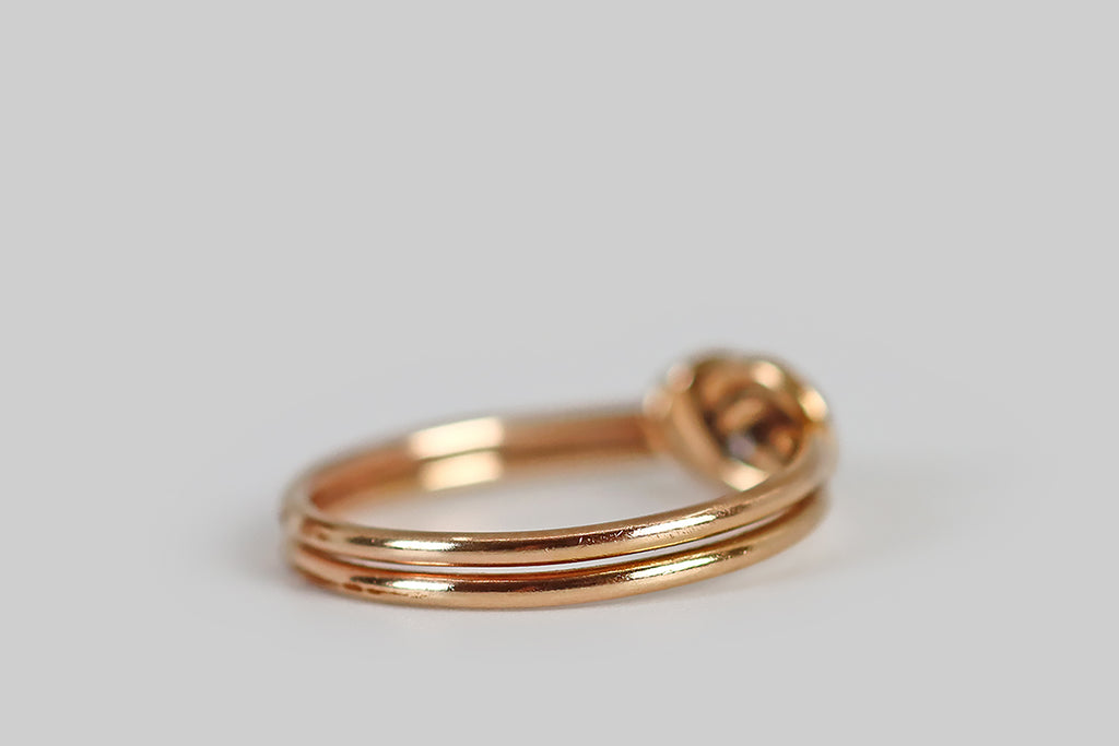 Poor Mouchette | Curated Antique Jewelry, Vintage Jewelry & Engagement Rings | A sweet, Victorian era ring, modeled in 14k rosy yellow gold, that takes the form of a knot fashioned from two round gold wires. These wires were literally tied together during the ring's construction. The ring shanks have been finished separately, at the base.
