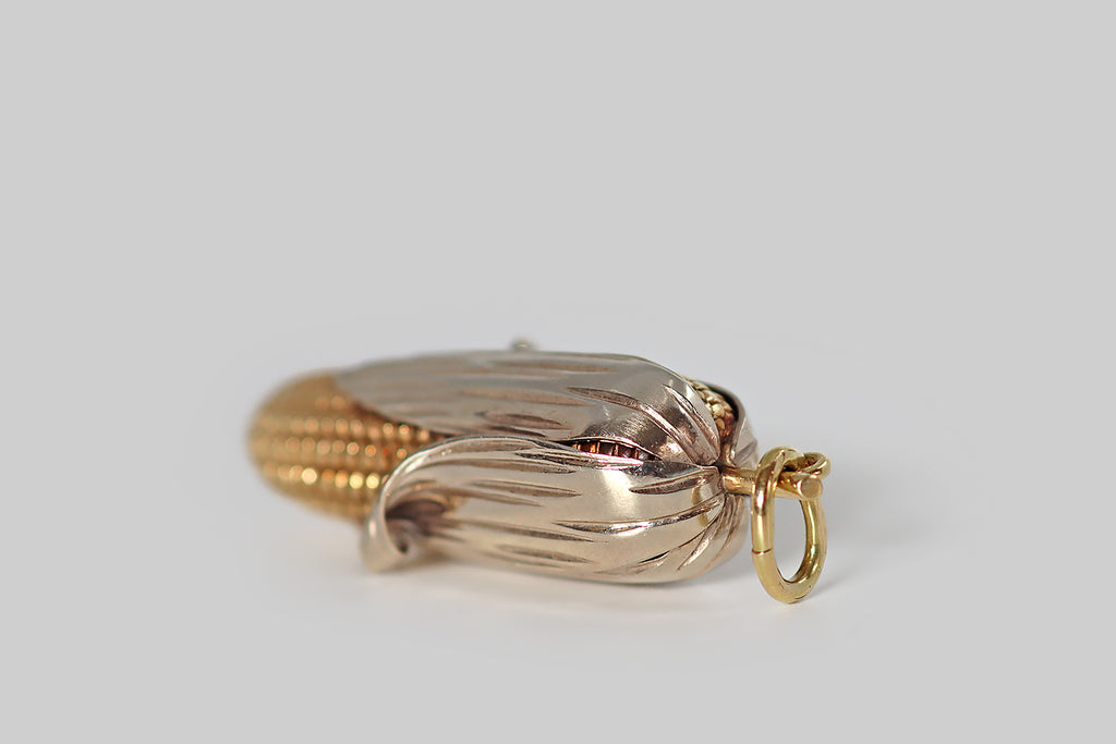 Antique Jewelry Portland, Vintage Jewelry Portland , Antique Engagement Rings | Poor Mouchette |A very cool, extra-large, mid-twentieth-century pendant, modeled in 14k yellow and white gold to resemble an ear of corn, with its husk partly peeled back! This ear of corn was made with incredible attention to detail— the yellow gold cob is covered with crisp, high-relief kernels that graduate in size, while the white gold husk is smooth and polished