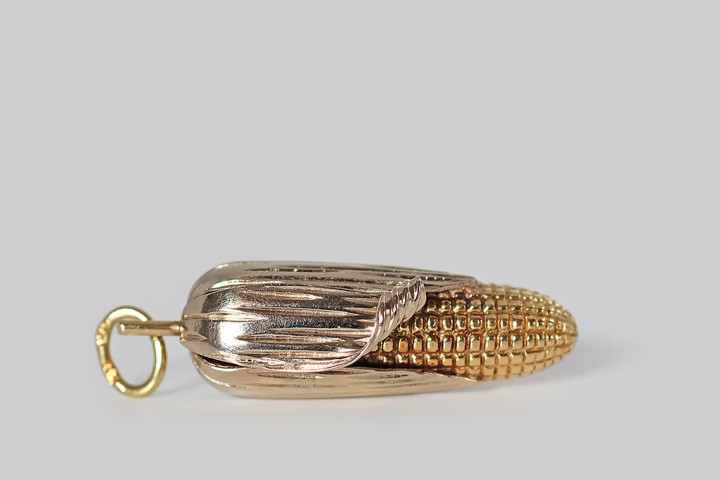Antique Jewelry Portland, Vintage Jewelry Portland , Antique Engagement Rings | Poor Mouchette |A very cool, extra-large, mid-twentieth-century pendant, modeled in 14k yellow and white gold to resemble an ear of corn, with its husk partly peeled back! This ear of corn was made with incredible attention to detail— the yellow gold cob is covered with crisp, high-relief kernels that graduate in size, while the white gold husk is smooth and polished