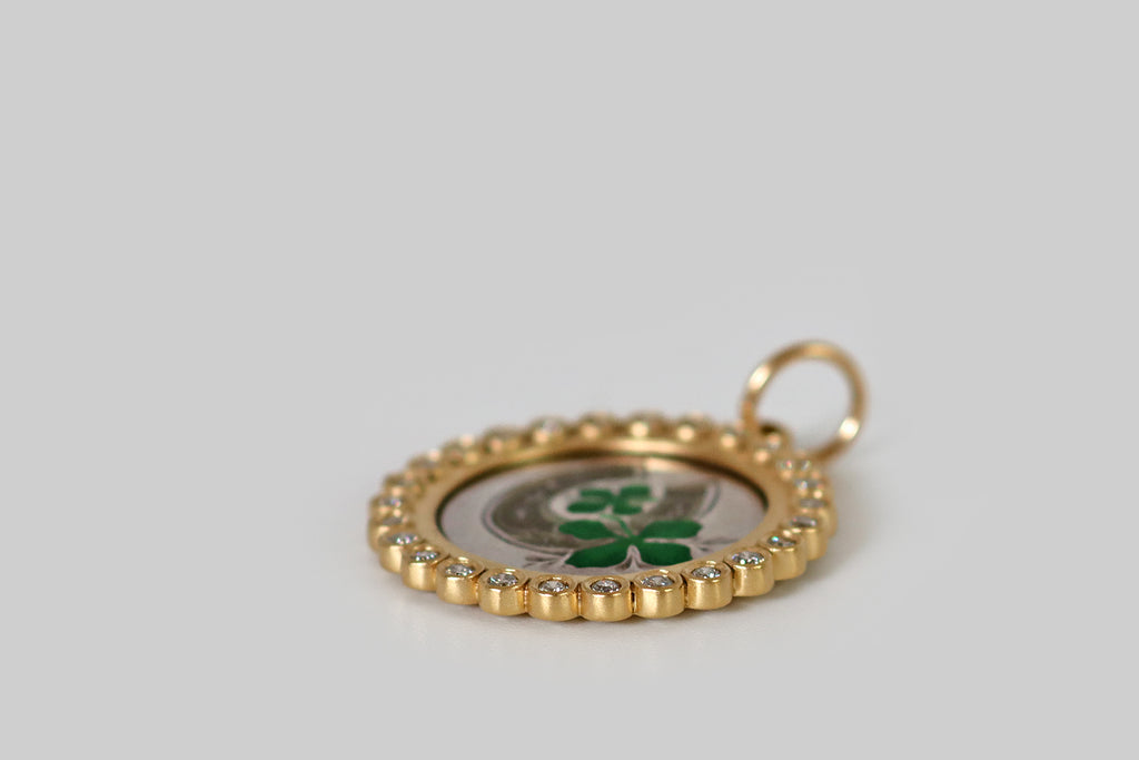 Poor Mouchette | Curated Antique Jewelry, Vintage Jewelry & Engagement Rings | Portland, Oregon | A turn of the century silver love token, decorated with a hand-engraved horseshoe and a pair of four leaf clovers! This charming "good luck" love token is embellished with enamel in kelly green and very-subtle, translucent yellow. we have mounted it in a newly-hand-made 18k gold frame