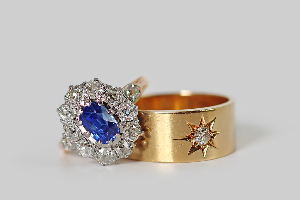 Poor Mouchette | Curated Antique Jewelry, Vintage Jewelry & Engagement Rings | A striking Edwardian-era cluster ring, modeled in 18k gold and platinum, whose primary gem is a bright, highly-saturated, 1.9 carat, no-heat Ceylon sapphire (GIA certified). This vibrant, old cushion-cut sapphire is mounted in ten prongs, and surrounded by a halo of ten, near-colorless, old European cut diamonds (H/I, VS-SI).
