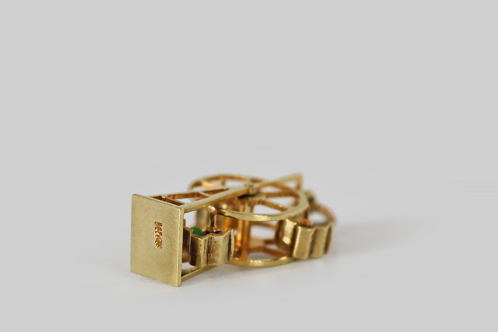 Antique Jewelry Portland, Vintage Jewelry Portland , Antique Engagement Rings | Poor Mouchette | An adorable vintage ferris wheel charm, fabricated in 14k yellow gold, by the well-known New York Jewelers Sloan &amp; Co. This miniature ferris wheel spins freely around a central shaft. Tiny couples, decorated with blue, green, red, and turquoise enamel, tip back and forth in their seats, when the wheel turns. 