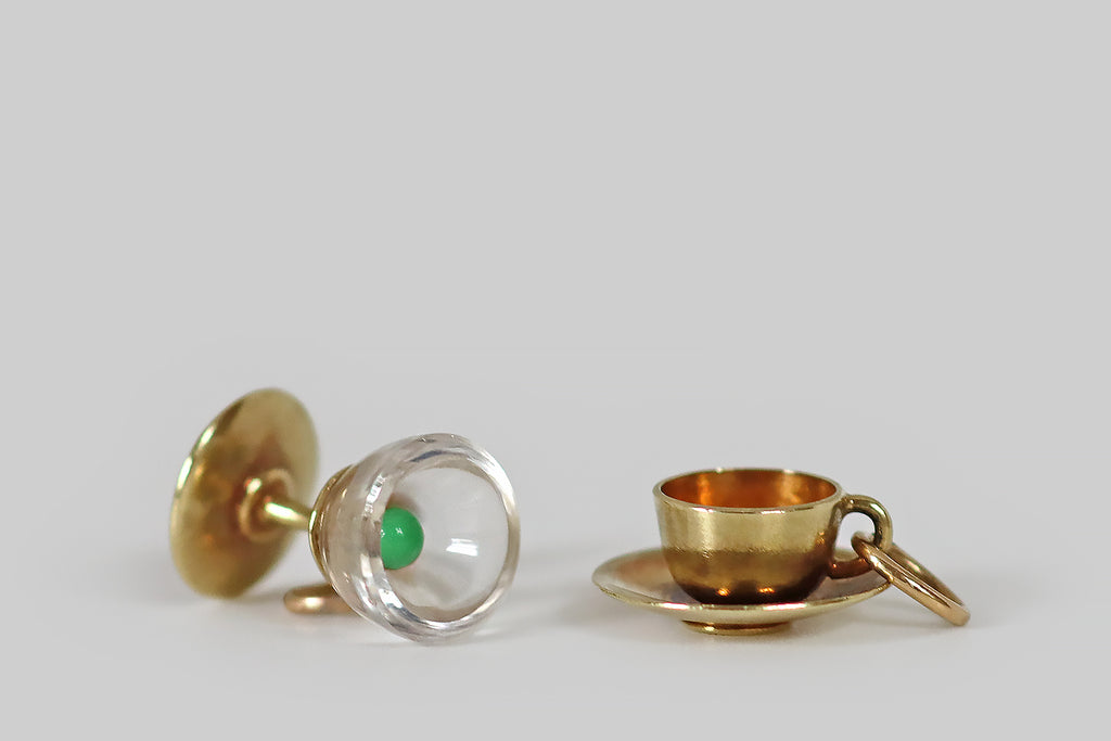 Antique Jewelry Portland, Vintage Jewelry Portland , Antique Engagement Rings | Poor Mouchette | A dainty, vintage charm, modeled as a teacup and saucer, in 14k yellow gold. This miniature cup and saucer is beautifully made— it is well-suited to anyone who takes tea over tipple, or tipple in their tea!