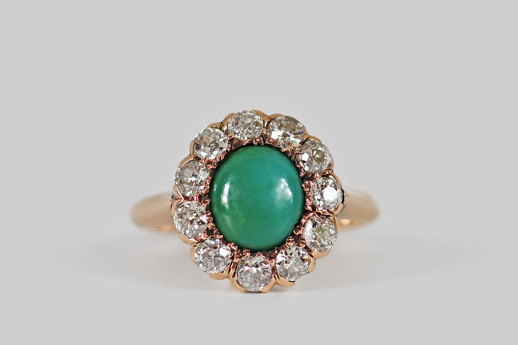 Antique Jewelry Portland, Vintage Jewelry Portland , Antique Engagement Rings | Poor Mouchette | A low-profile, Victorian era cluster ring, modeled in 14k rosy yellow gold, whose central, turquoise gemstone is encircled by a halo of eleven old European cut diamonds. This turquoise is green-blue, with subtle, nebulous variegation. It has acquired a beautiful, silky, jade-like lustre, in the course of its life. The surrounding, chunky OEC diamonds are bright and lively (H/I, VS1-SI1)