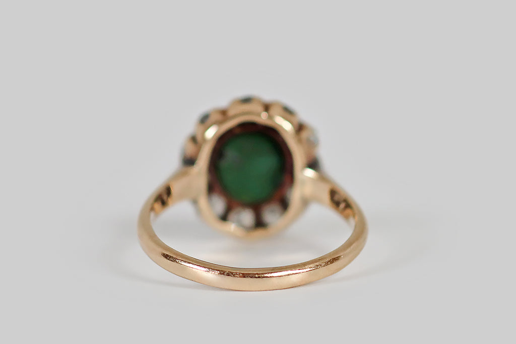 Antique Jewelry Portland, Vintage Jewelry Portland , Antique Engagement Rings | Poor Mouchette | A low-profile, Victorian era cluster ring, modeled in 14k rosy yellow gold, whose central, turquoise gemstone is encircled by a halo of eleven old European cut diamonds. This turquoise is green-blue, with subtle, nebulous variegation. It has acquired a beautiful, silky, jade-like lustre, in the course of its life. The surrounding, chunky OEC diamonds are bright and lively (H/I, VS1-SI1)