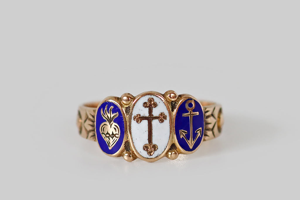 Antique Jewelry Portland, Vintage Jewelry Portland , Antique Engagement Rings | Poor Mouchette | A precious, Victorian era, cigar band ring, modeled in 10k rosy yellow gold, whose design centers on three oval plaques, decorated with white and cobalt-blue enamel. These enamels— a cross, an anchor, and a sacred heart— represent the virtues faith, hope, charity. Each symbol is raised in gold, and surrounded by a field of color. Between them (at the crown points of each plaque) balls of granulation 