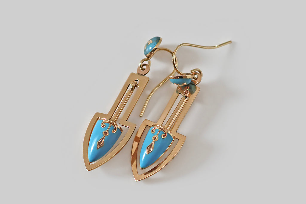 Antique Jewelry Portland, Vintage Jewelry Portland , Antique Engagement Rings | Poor Mouchette | A fantastic pair of Victorian earrings, modeled in 14k rosy yellow gold, whose pendulum drops swing back and forth inside arrow-like "frames," hand-pierced from gold sheet. Our pendulums are decorated with vibrant, robin's egg blue enamel, and they are incised with polished Etruscan curls and swags. These playful, swinging 
