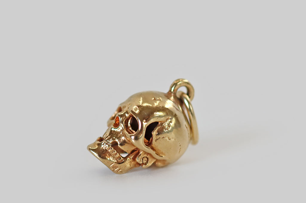 Poor Mouchette | Curated Antique Jewelry, Vintage Jewelry & Engagement Rings | Portland, Oregon | A really wonderful vintage charm, modeled in 14k yellow gold, that was made to resemble a human skull. This miniature skull is highly detailed, with defined cranial sutures, missing teeth, expressive eye sockets, and a moving jaw! 