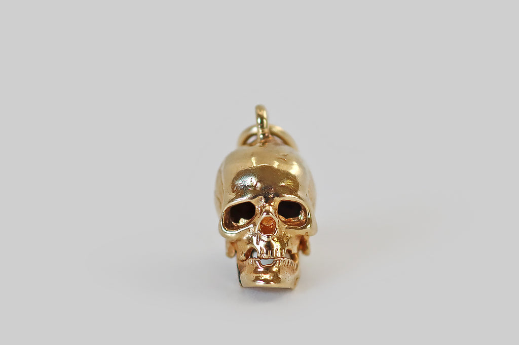 Poor Mouchette | Curated Antique Jewelry, Vintage Jewelry & Engagement Rings | Portland, Oregon | A really wonderful vintage charm, modeled in 14k yellow gold, that was made to resemble a human skull. This miniature skull is highly detailed, with defined cranial sutures, missing teeth, expressive eye sockets, and a moving jaw! 