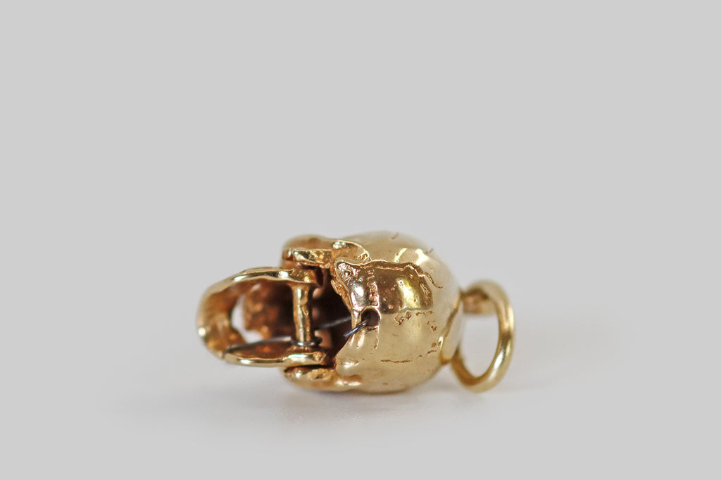 Poor Mouchette | Curated Antique Jewelry, Vintage Jewelry & Engagement Rings | Portland, Oregon | A really wonderful vintage charm, modeled in 14k yellow gold, that was made to resemble a human skull. This miniature skull is highly detailed, with defined cranial sutures, missing teeth, expressive eye sockets, and a moving jaw! 