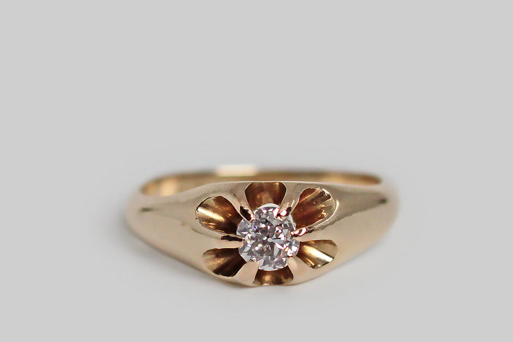 A charming, Victorian-era, Belcher claw ring, modeled in 14k yellow gold, whose six, tapering prongs hold a glittering, .30 carat, old mine cut diamond. The belcher setting is a simple, elegant style, named for its creator, Thomas Belcher— this one is especially graceful, with long, rounded, cutaway sections that give the ring face a floral appearance and create an abundance of light behind its diamond.