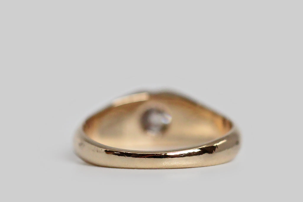 A charming, Victorian-era, Belcher claw ring, modeled in 14k yellow gold, whose six, tapering prongs hold a glittering, .30 carat, old mine cut diamond. The belcher setting is a simple, elegant style, named for its creator, Thomas Belcher— this one is especially graceful, with long, rounded, cutaway sections that give the ring face a floral appearance and create an abundance of light behind its diamond.