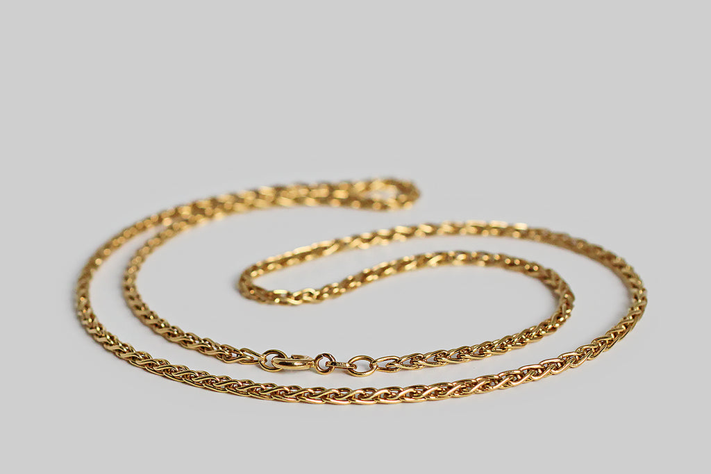 Poor Mouchette | Curated Antique Jewelry, Vintage Jewelry & Engagement Rings | Portland, Oregon | A weighty, 18k yellow gold, foxtail-link chain, manufactured by the Italian makers, Balestra. This 20" chain is comprised of solid, looping links that overlap in a braid-like manner. This is luxurious, but not ostentatious— it has a perfectly fluid hand, and lays beautifully in wear.