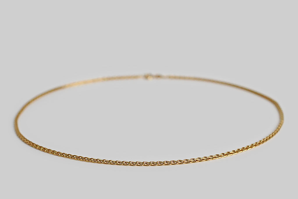 Poor Mouchette | Curated Antique Jewelry, Vintage Jewelry & Engagement Rings | Portland, Oregon | A weighty, 18k yellow gold, foxtail-link chain, manufactured by the Italian makers, Balestra. This 20" chain is comprised of solid, looping links that overlap in a braid-like manner. This is luxurious, but not ostentatious— it has a perfectly fluid hand, and lays beautifully in wear.