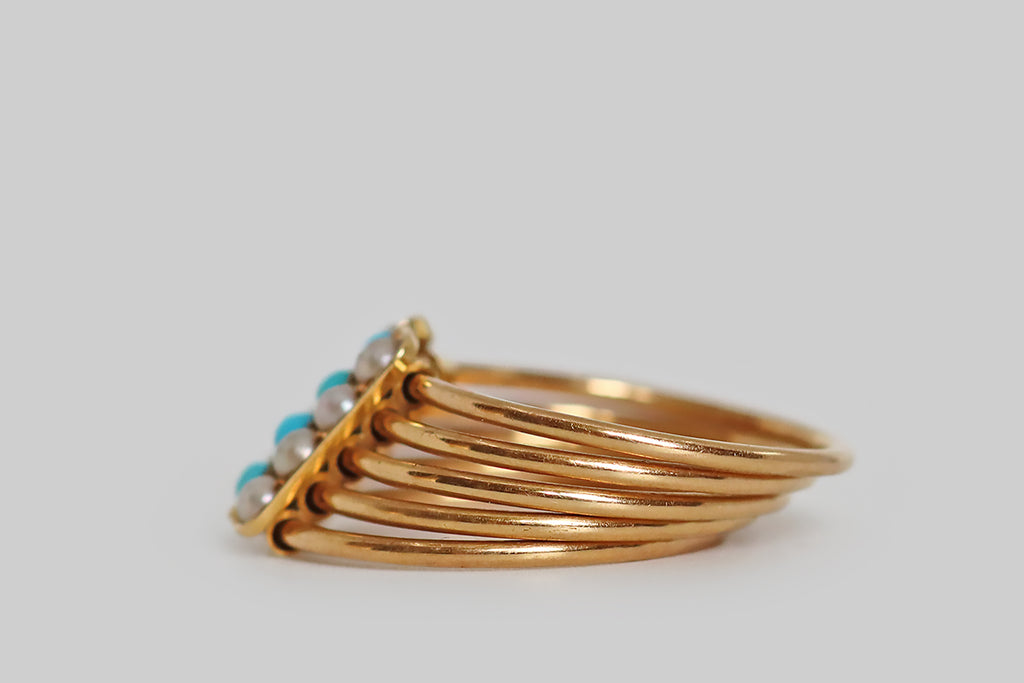 Poor Mouchette | Curated Antique Jewelry, Vintage Jewelry & Engagement Rings | Portland, Oregon | A Victorian-era, five-band, harem ring, modeled in 18k rosy yellow gold, set with natural, blue turquoise cabochons (four) and natural seed pearls (eight). This ring's five, separate, fully-round bands are trapped inside the sliding, gem-set panels that create the ring face. These three lozenge shaped "sliders"