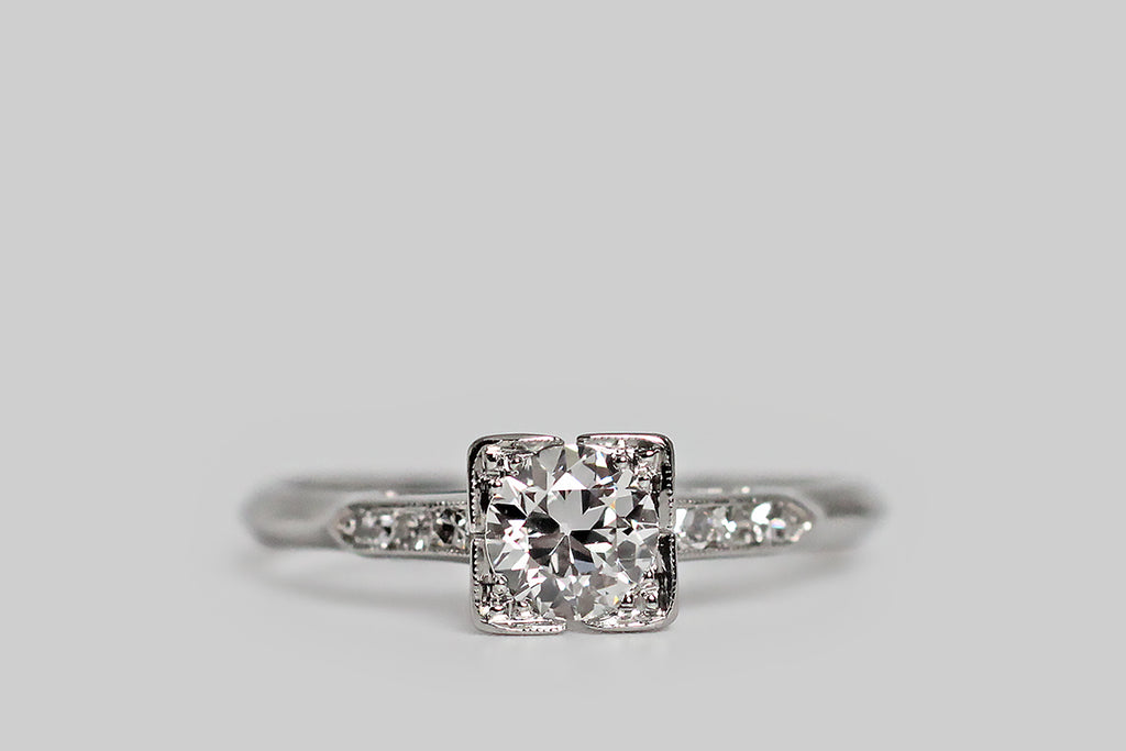 Poor Mouchette | Curated Antique Jewelry, Vintage Jewelry & Engagement Rings | Portland, Oregon | A charming 1930s wedding set, modeled in platinum, whose engagement ring features an especially pretty 1/2 carat Old European cut diamond (F/VVS). This sparkling, hand-cut old sweetheart is mounted in a square, split-lipped basket, where clover-like trios of beads hold it securely in place. The ring head is elegant, visually delicate, and a small heart hides in its gallery