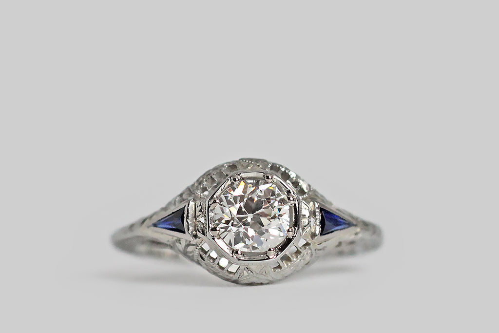 Poor Mouchette | Curated Antique Jewelry, Vintage Jewelry & Engagement Rings | Portland, Oregon | An elegant Art Deco era ring, modeled in 18k white gold by the well-known American jewelers Belais, whose primary gem is a .62 carat old European cut diamond. This lively old diamond is bead-set into an octagonal seat, that nests in the ring's round face. 