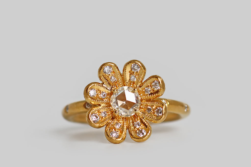 Poor Mouchette | Curated Antique Jewelry, Vintage Jewelry & Engagement Rings | Portland, Oregon | A beautiful flower-form ring, created by Cathy Waterman in, 22k yellow gold. This high karat daisy features a white rose cut diamond (G/H, SI), resting at its center like a drop of water, in four prongs.
