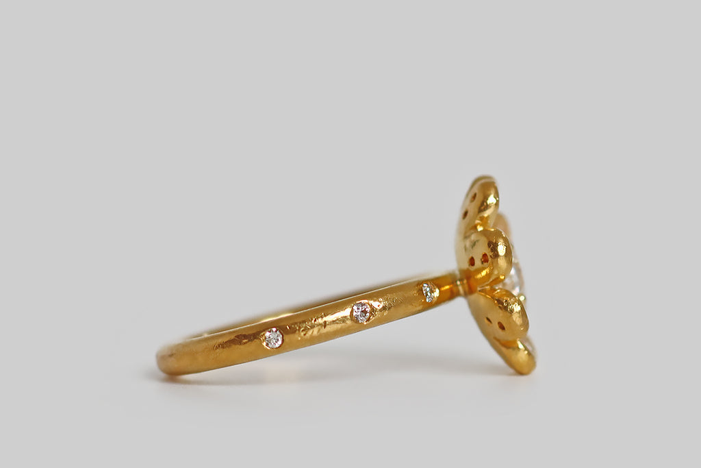 Poor Mouchette | Curated Antique Jewelry, Vintage Jewelry & Engagement Rings | Portland, Oregon | A beautiful flower-form ring, created by Cathy Waterman in, 22k yellow gold. This high karat daisy features a white rose cut diamond (G/H, SI), resting at its center like a drop of water, in four prongs.