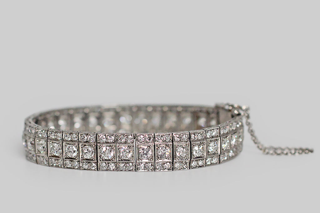 An exceptional Art Deco era bracelet, composed of thirty-six, flexible, diamond-set links. These beautifully-constructed links move very smoothly, in a sinuous manner that plays up the intensity of the bracelet's already intense sparkle. The bracelet's many, chunky, old European cut diamonds face up very white in their platinum mounts; they have the small high tables and open culets that make this cut so beloved. Old cut diamonds