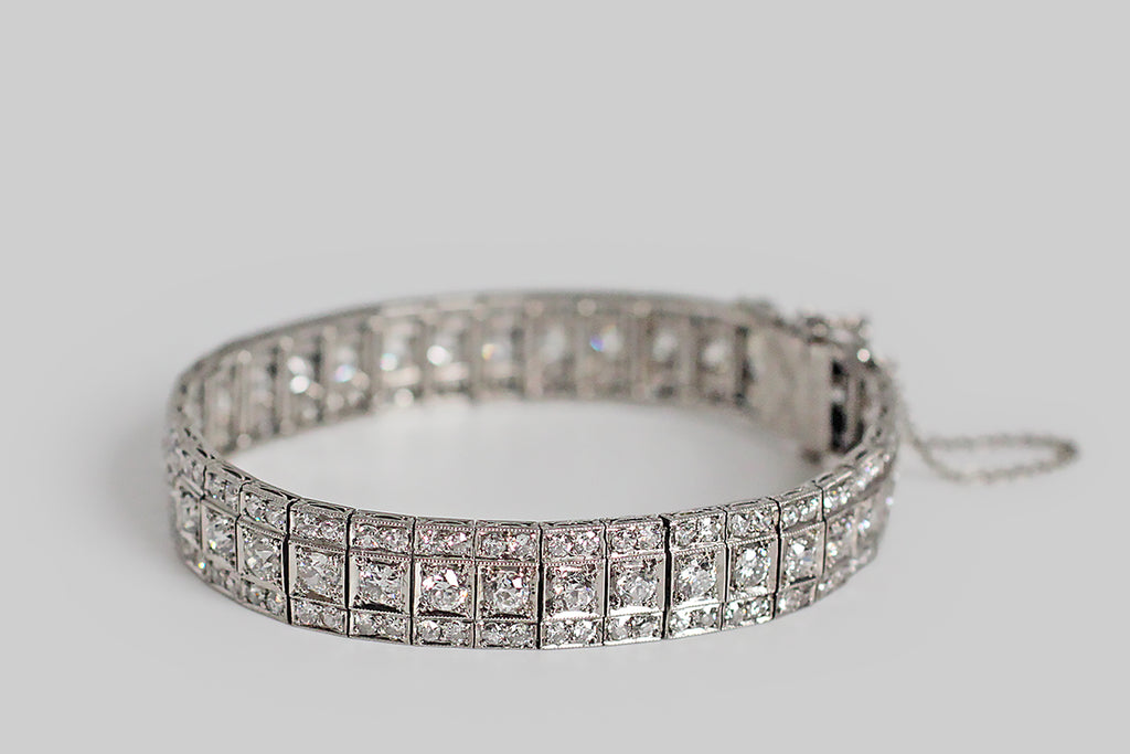 An exceptional Art Deco era bracelet, composed of thirty-six, flexible, diamond-set links. These beautifully-constructed links move very smoothly, in a sinuous manner that plays up the intensity of the bracelet's already intense sparkle. The bracelet's many, chunky, old European cut diamonds face up very white in their platinum mounts; they have the small high tables and open culets that make this cut so beloved. Old cut diamonds