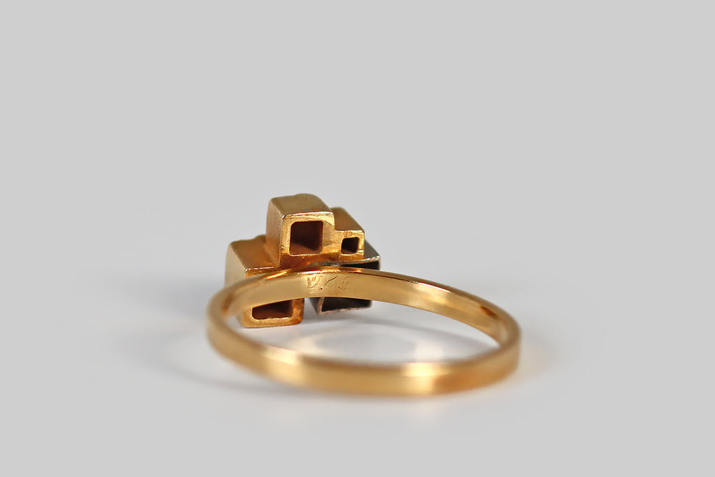 Antique Jewelry Portland, Vintage Jewelry Portland , Antique Engagement Rings | Poor Mouchette | A very cool vintage modernist ring, by the beloved design house Lapponia Finland, modeled in 18k yellow gold and platinum. This ring features a small, sparkling brilliant cut diamond (F/G, VS), which is bead-set into a deep platinum cube. This diamond-faced cube lives alongside three others, that are fashioned in yellow gold.