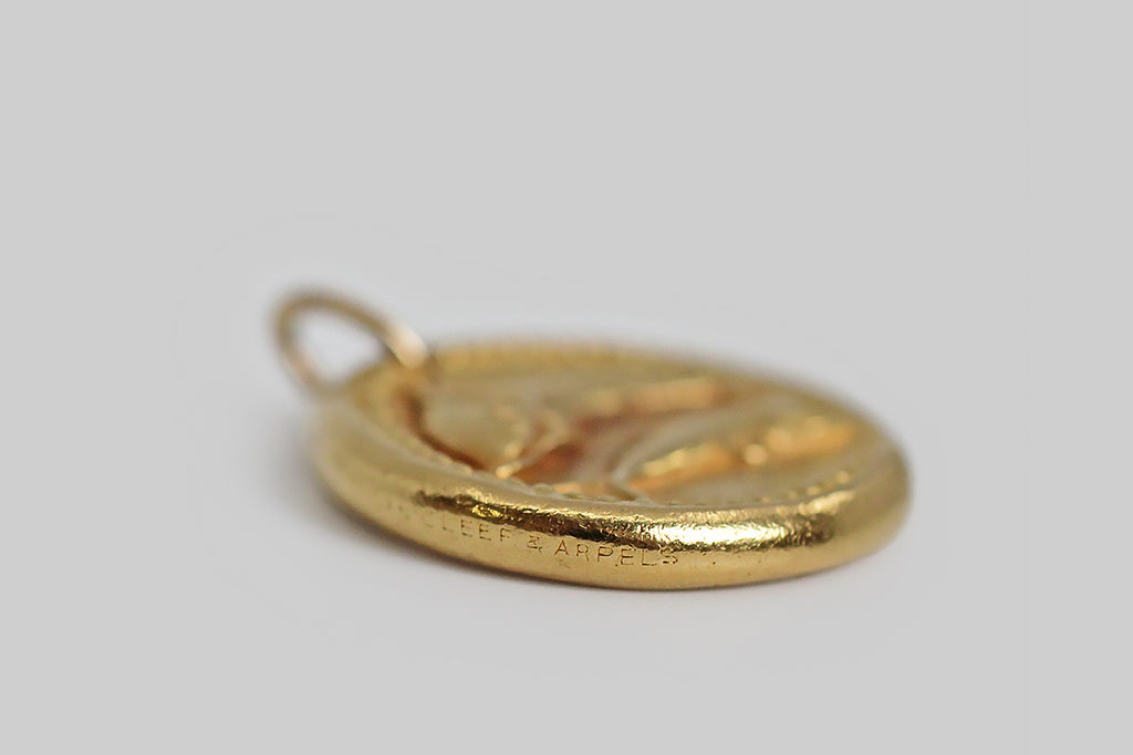 A rare and iconic vintage zodiac pendant by Van Cleef & Arpels. This pisces pendant, and the other designs in this 1960s -1970s zodiac series, was made to recall an ancient roman coin, with the slightly craggy textural qualities you would expect to find in something ancient, and with nicks at the edges that are integral to the design. 
