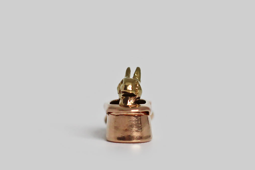 Poor Mouchette | Curated Antique Jewelry, Vintage Jewelry & Engagement Rings | Portland, Oregon | A seriously miniature, bi-color, 1940s charm, modeled in 14k rose and yellow gold, depicting a rabbit sitting inside a magician’s top hat. This tiny charm is wonderful, unusual, and its old gold surfaces are perfectly worn and buttery. Ever feel like you pulled a rabbit out of a hat? This guy is the embodiment of that idiom, and a little talisman for those of us who cherish the unexpected!