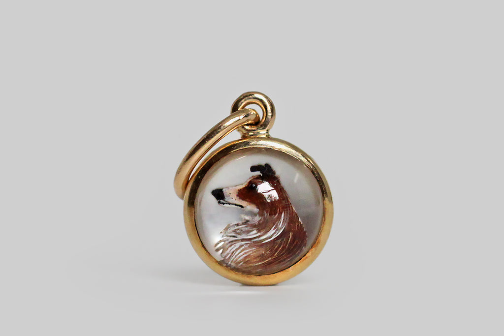 Poor Mouchette | Curated Antique Jewelry, Vintage Jewelry & Engagement Rings | Portland, Oregon | A very miniature, Victorian-era, reverse painted intaglio pendant, modeled in 14k yellow gold, whose subject is a sable-colored Collie, depicted in profile. Our watchful canine’s likeness was carved into the backside of this high-domed crystal— the recessed areas were then painted with a tiny, hair-fine brush. This "Essex crystal"