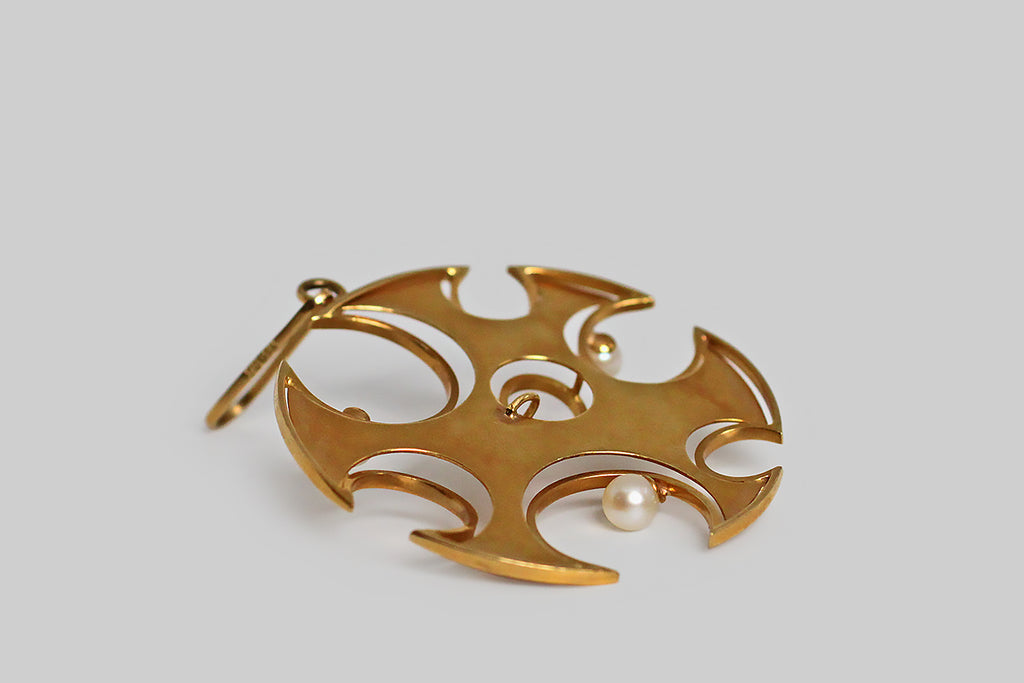 Poor Mouchette | Curated Antique Jewelry, Vintage Jewelry & Engagement Rings | Portland, Oregon | A striking, oversized, mid 20th century, modernist pendant, modeled in 18k yellow gold and set with a clutch of lustrous cultured pearls. This playful jewel is a study in circular forms— the primary shape is a large circle from whose edges smaller circles, of various sizes, have been removed. 