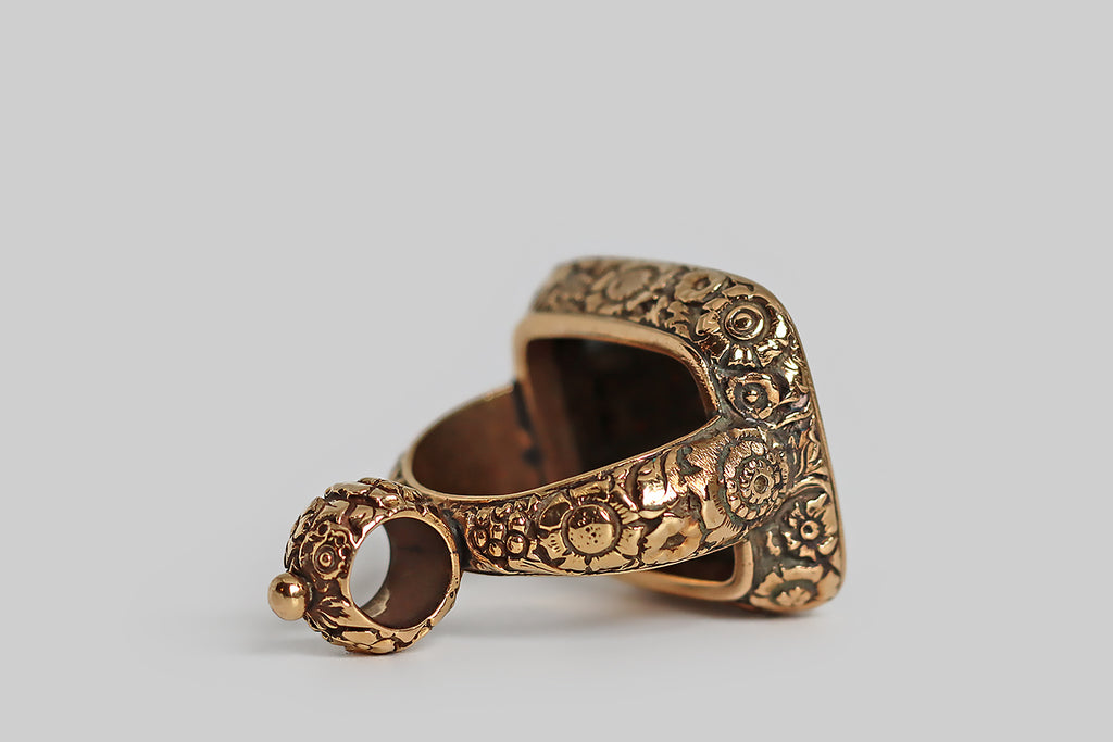 Poor Mouchette | Curated Antique Jewelry, Vintage Jewelry & Engagement Rings | Portland, Oregon | A striking, extra-large, Georgian era fob, modeled in 14k yellow gold and set with a rectangular, intaglio-carved, bloodstone gem. This finely-carved wax seal features a coat of arms, atop which stands a rampant lion. This coat of arms is "impaled" to indicate a marriage. The sinister field is divided, diagonally, "party per bend—" the charge depicted in the top half of this field is an eradicated tree