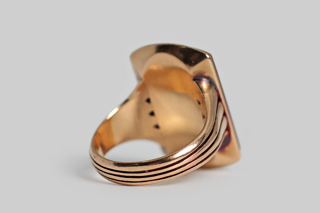 Poor Mouchette | Curated Antique Jewelry, Vintage Jewelry & Engagement Rings | Portland, Oregon | An outstanding, Victorian-era signet ring, modeled in 15k rosy yellow gold, whose hardstone gem features an intaglio carving of a svelt tiger, in passant attitude. Our tiger wears a collar . . . his tail curls, and his tongue lolls. Above this handsome feline, a scrolling banner holds the French motto toujours pret— "always ready." This rectangular, hardstone gem (sometimes called sardonyx)