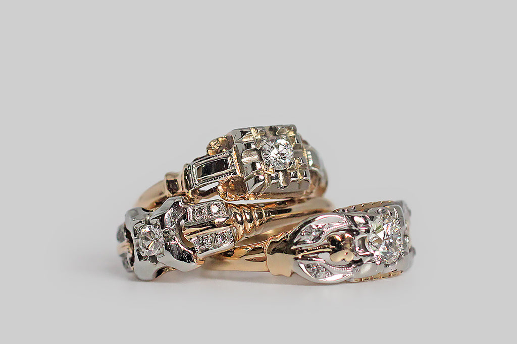 A charming, 1940s engagement ring, modeled in white and rosy-yellow 14k gold. This old darling features a transitional cut diamond, which is bead-set into the ring's unique, x-shaped face. Two pairs of diamond-studded epaulettes add interest to the ring's shoulders, along with a subtle ribbed detail. The half-round shank tapers toward the base. Marked 14k for purity.