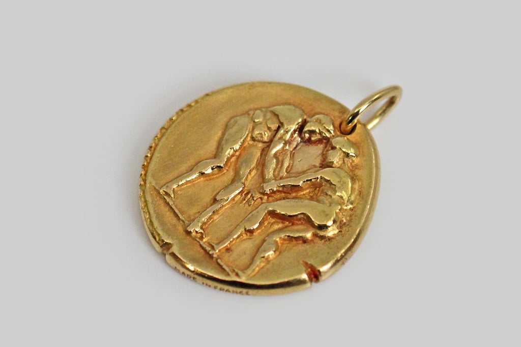 A rare and iconic vintage zodiac pendant by Van Cleef & Arpels. This Gemini pendant, and the other designs in this 1960s -1970s zodiac series, was made to recall an ancient roman coin, with the slightly craggy textural qualities you would expect to find in something ancient, and with nicks at the edges that are integral to the design. 