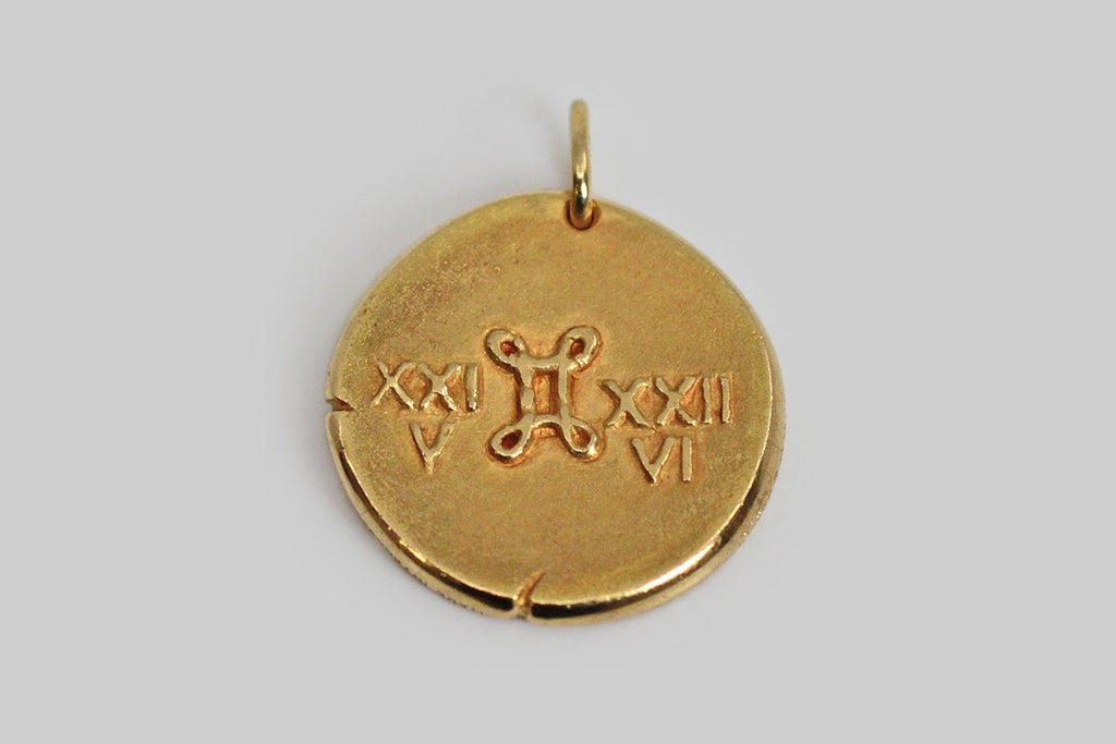 A rare and iconic vintage zodiac pendant by Van Cleef & Arpels. This Gemini pendant, and the other designs in this 1960s -1970s zodiac series, was made to recall an ancient roman coin, with the slightly craggy textural qualities you would expect to find in something ancient, and with nicks at the edges that are integral to the design. 
