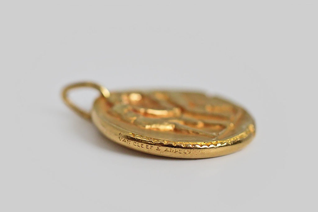 A rare and iconic vintage zodiac pendant by Van Cleef & Arpels. This Gemini pendant, and the other designs in this 1960s -1970s zodiac series, was made to recall an ancient roman coin, with the slightly craggy textural qualities you would expect to find in something ancient, and with nicks at the edges that are integral to the design. 