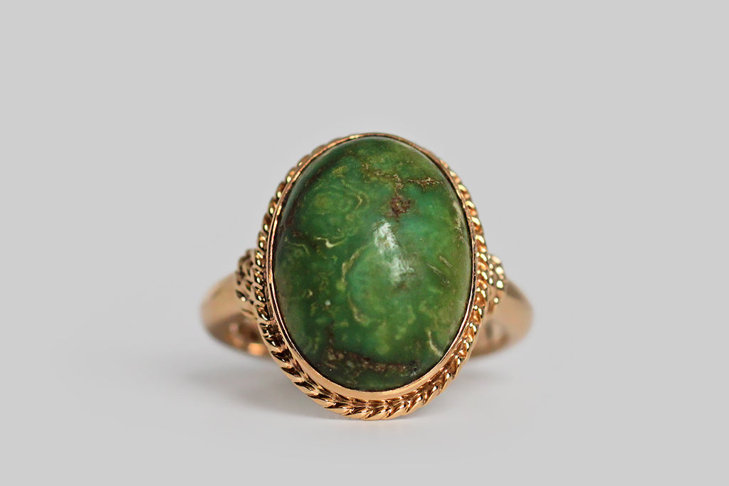 Poor Mouchette | Curated Antique Jewelry, Vintage Jewelry & Engagement Rings | Portland, Oregon | A substantially-made, mid 20th century ring, modeled in 14k yellow gold, set with a lovely, earthy-green, Variscite specimen. This bezel-set cabochon looks like the rare and beloved material that used to come from the Damele mine— the gem's pooling figuring is beautiful, giving the impression of a planet viewed from space! 