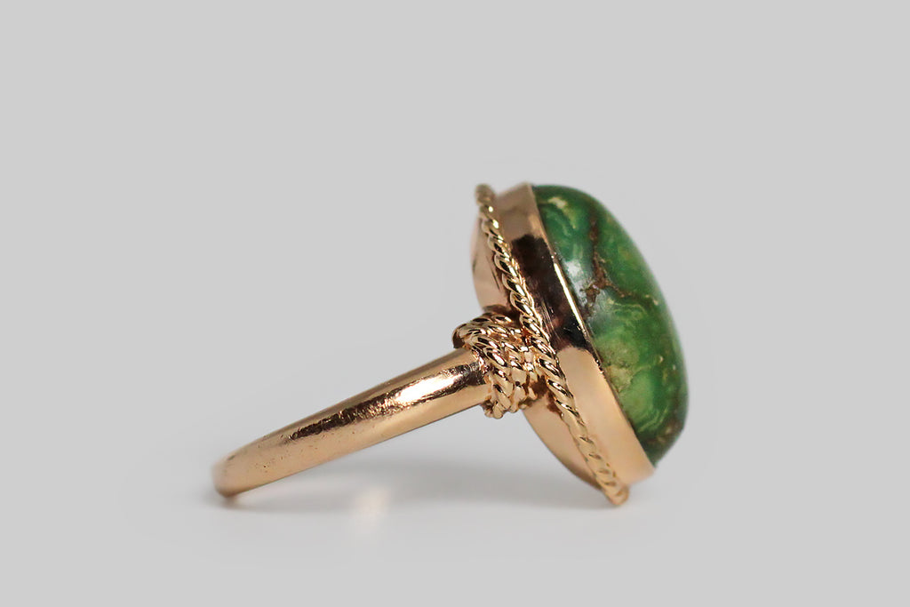 Poor Mouchette | Curated Antique Jewelry, Vintage Jewelry & Engagement Rings | Portland, Oregon | A substantially-made, mid 20th century ring, modeled in 14k yellow gold, set with a lovely, earthy-green, Variscite specimen. This bezel-set cabochon looks like the rare and beloved material that used to come from the Damele mine— the gem's pooling figuring is beautiful, giving the impression of a planet viewed from space!