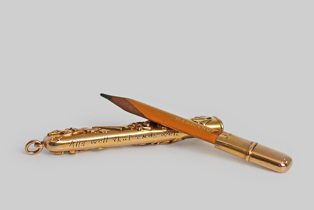 Antique Jewelry Portland, Vintage Jewelry Portland , Antique Engagement Rings | Poor Mouchette | A dandy, Victorian era pencil, modeled in 14k yellow gold and decorated on both sides with raised, pictorial representations of the four vices of man— horses, drink, women, and cards. The decorated half of this wonderful object functions as a sheath for a broad, flat carpenter's pencil, while the stub end is crimped around the pencil's base. These pieces fit snugly together.