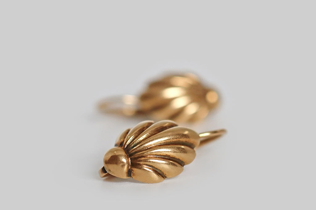 Poor Mouchette | Curated Antique Jewelry, Vintage Jewelry & Engagement Rings | Portland, Oregon | A wonderful pair of Victorian-era, shell-form earrings, modeled in 14k rosy yellow gold. These voluptuous little shells are sleek and elongated, their seven gradating rays emanate from the round base of each shell.