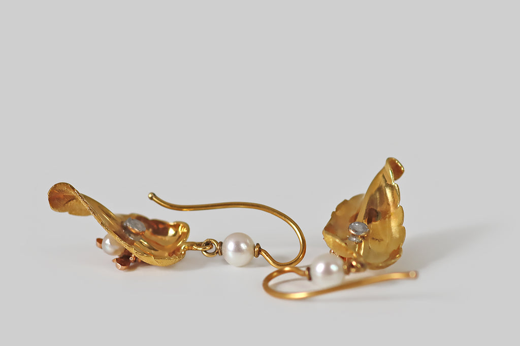 Antique Jewelry Portland, Vintage Jewelry Portland , Antique Engagement Rings | Poor Mouchette | A pair of antique, Victorian-era earrings, each modeled in 14k gold as a curling leaf, upon which a small housefly rests. These leaves are gracefully and realistically rendered, with bright-line veins and fine all-over stippling that communicates a leaf's delicate, celled texture.
